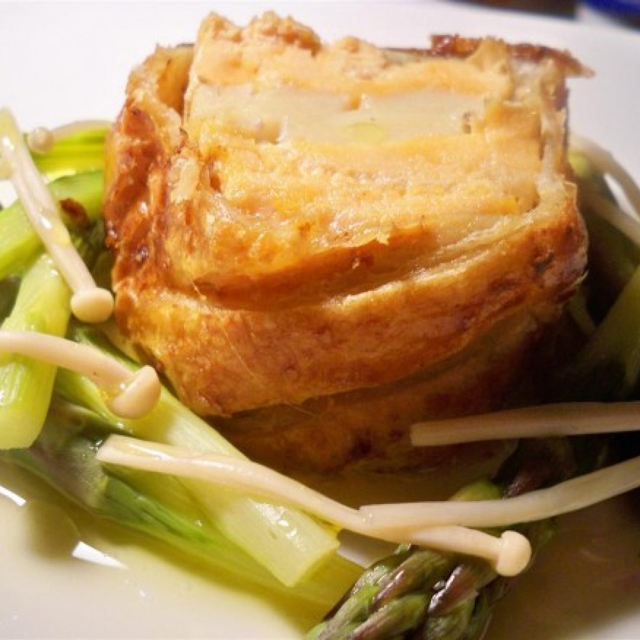 Scallop Stuffed Salmon Wellington with steamed Asparagus