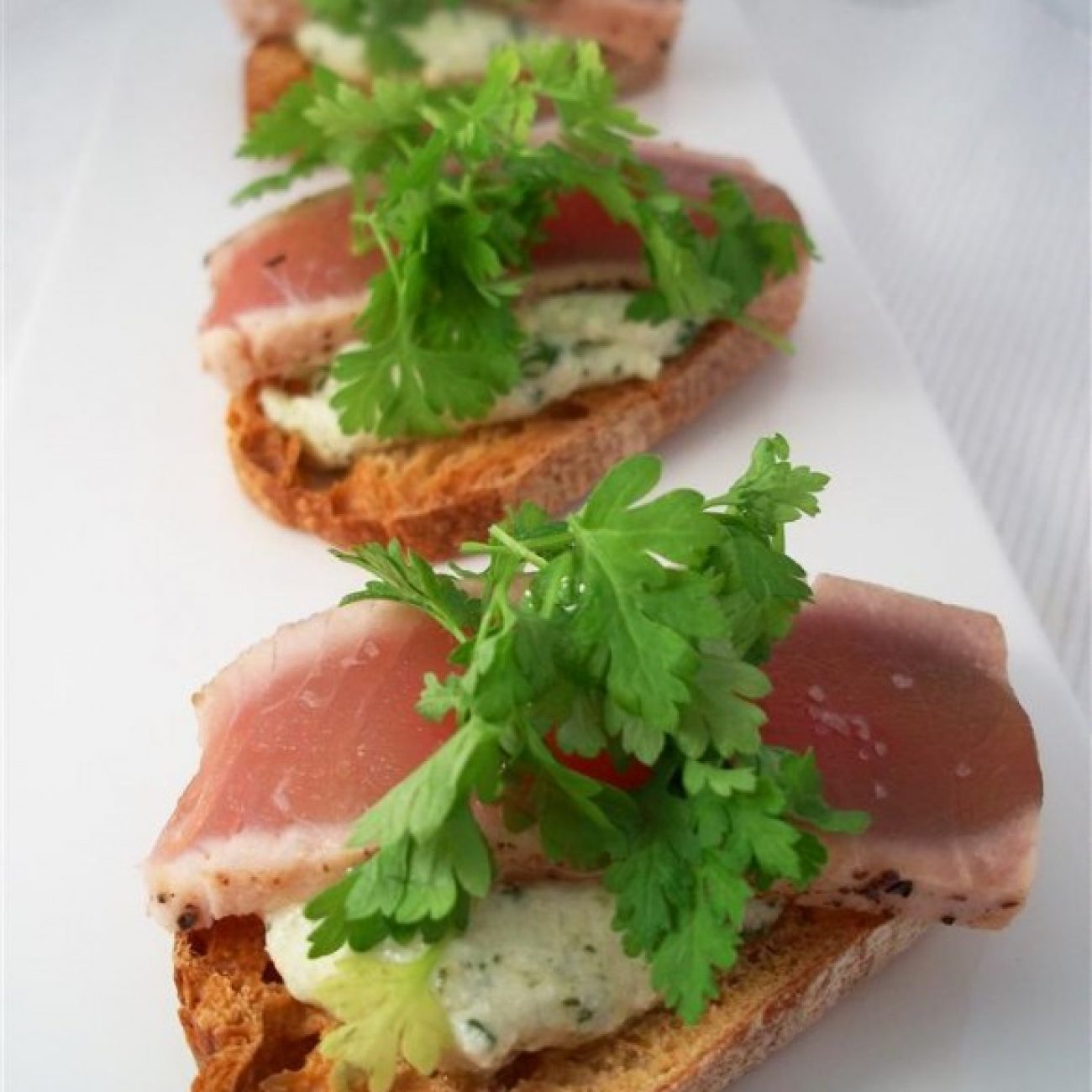 Seared tuna on herbed ricotta with chervil/white truffle oil