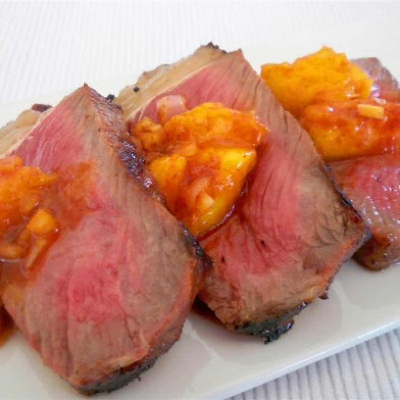 Rib eye steak with mango cinnamon salsa