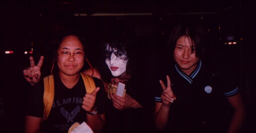 A band member with two fans.