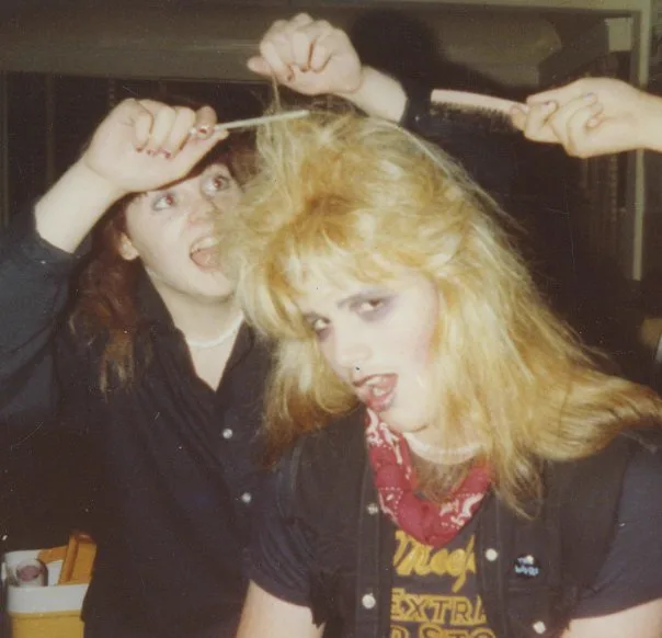 Blonde Benny having his hair teased before the show