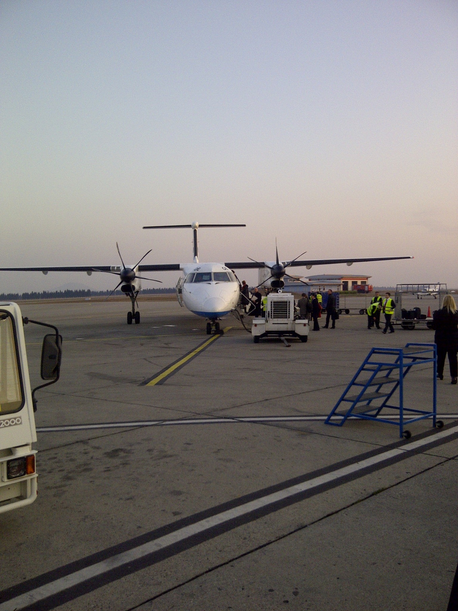 A turboprop aircraft waiting on the airport apron