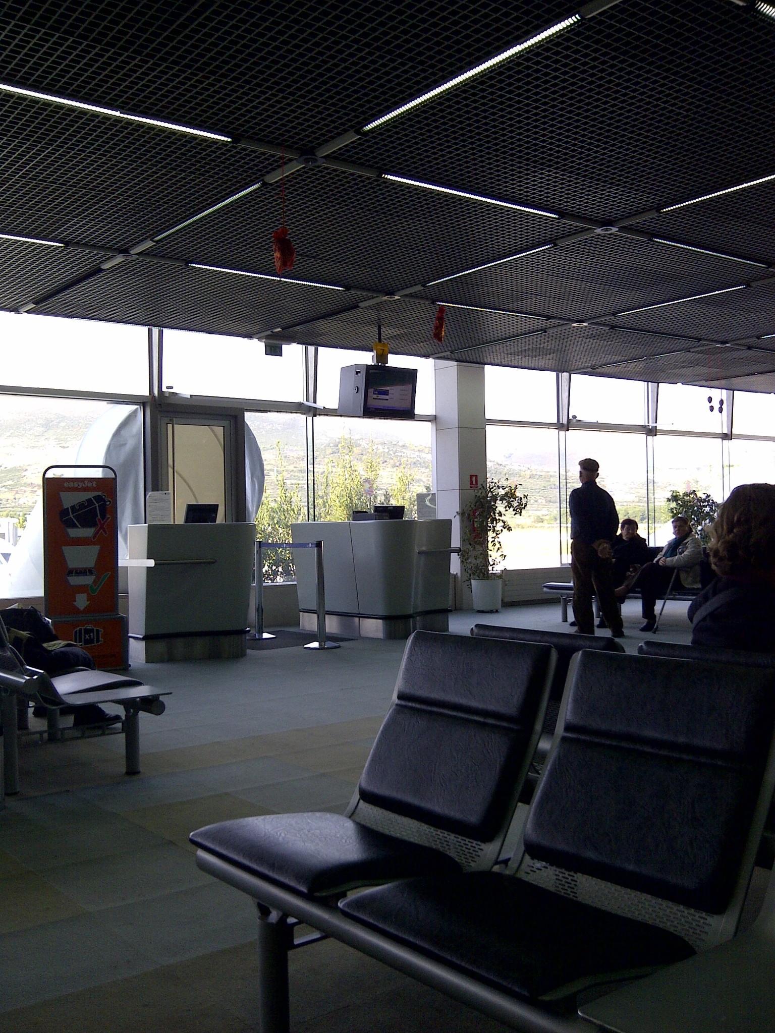 Passengers waiting at the airport gate