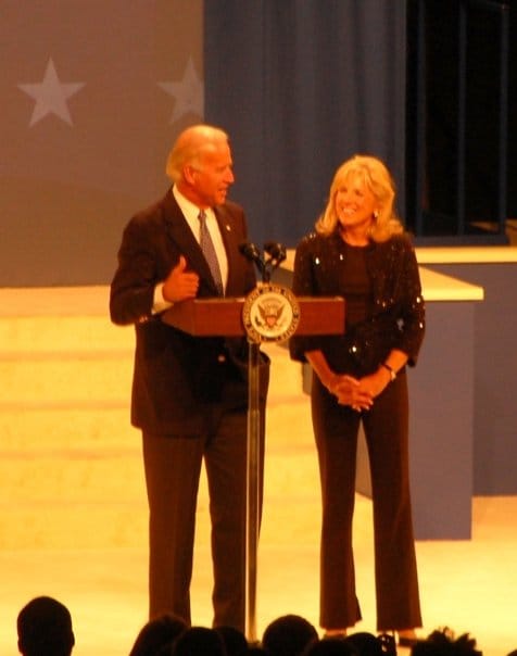 Joe and Jill Biden at the lectern on the Youth Ball stage