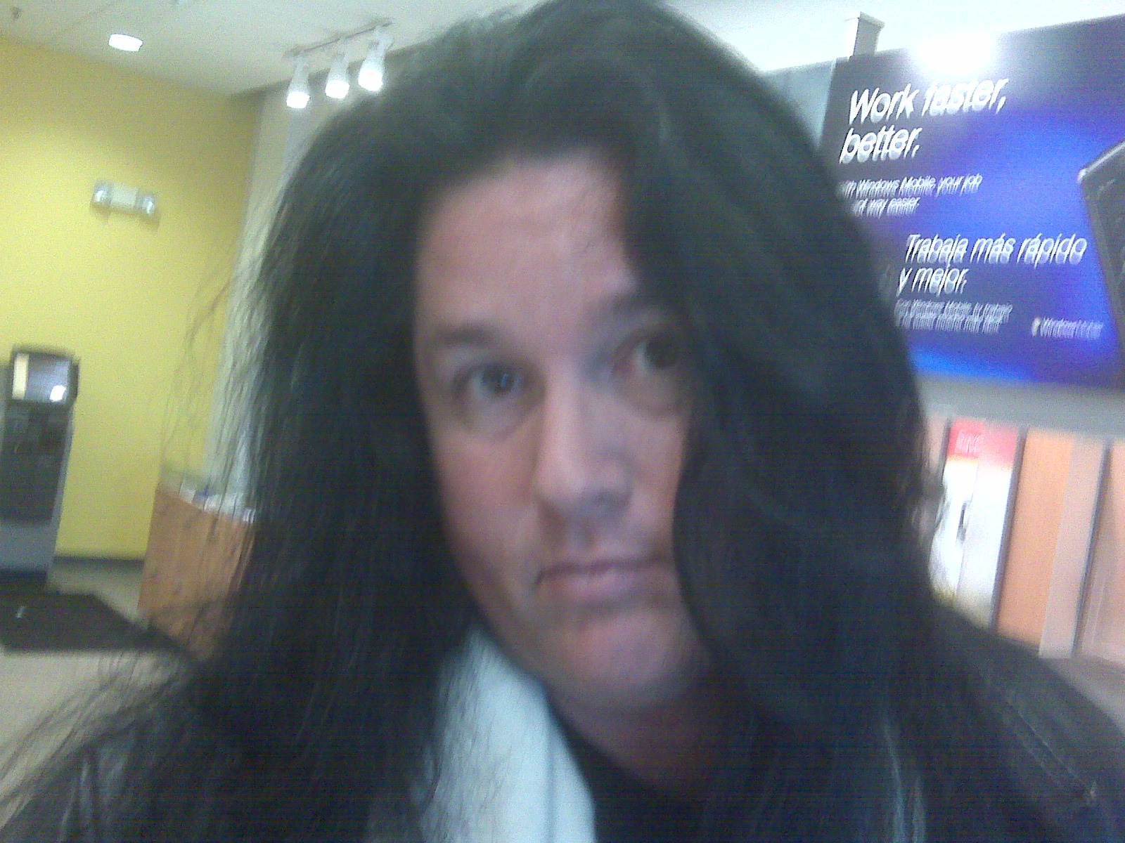 An informal indoor selfie of Benny with long dark hair