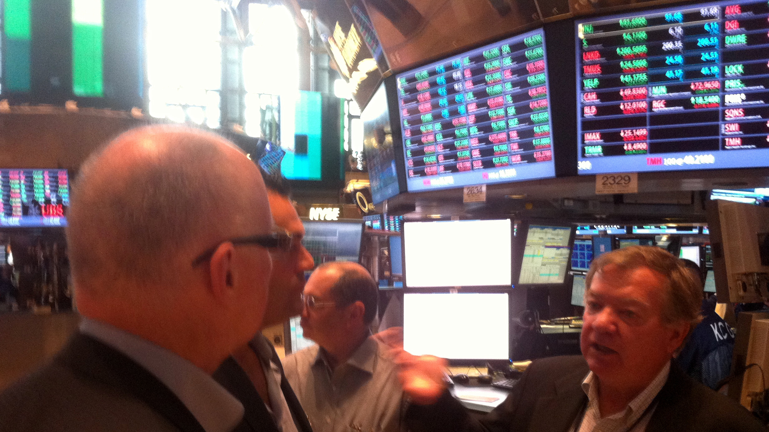 Charlie McLaughlin explaining the New York Stock Exchange floor to the Champion Pain Care team