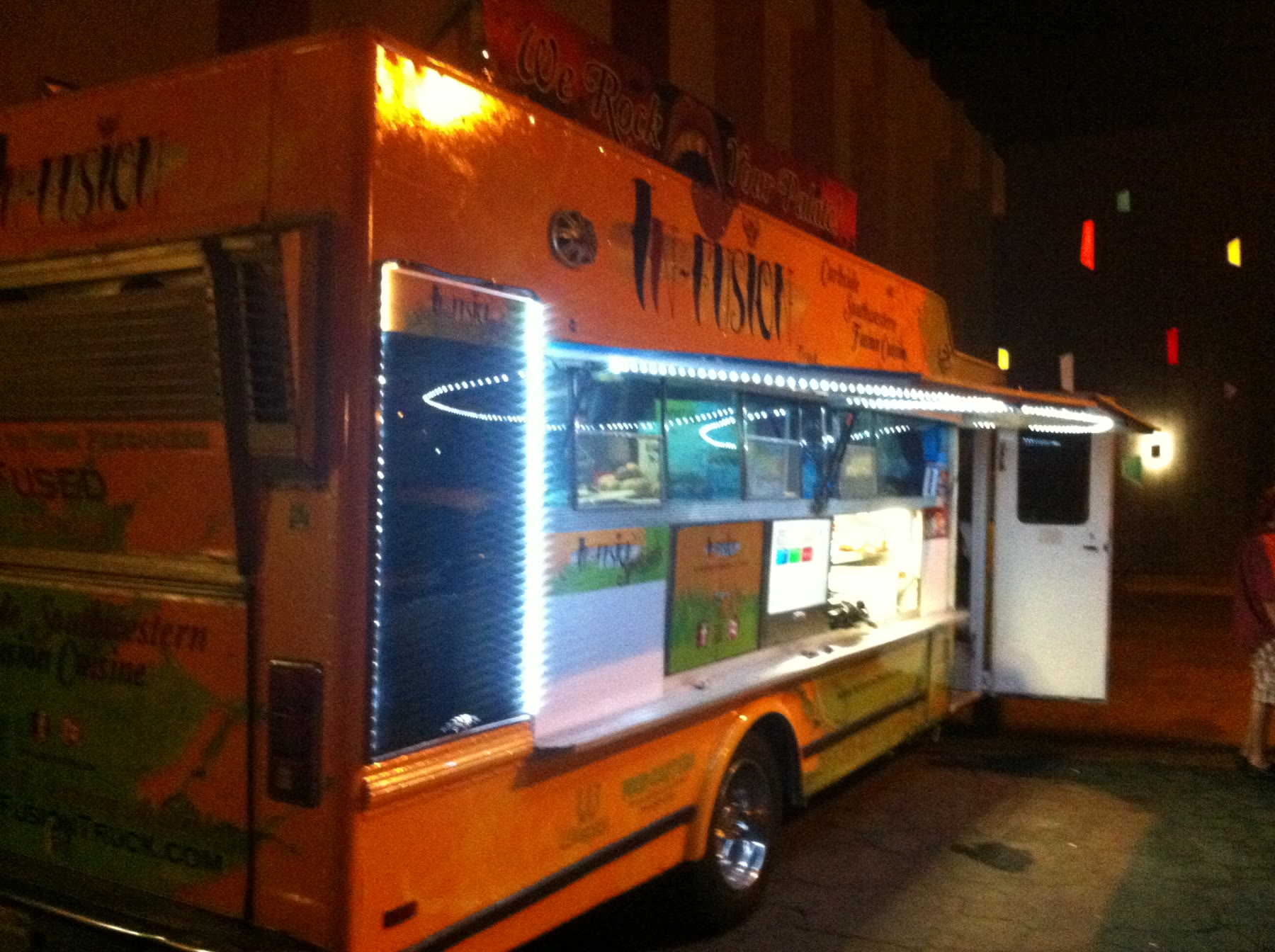 The completed InFusion truck illuminated at night.