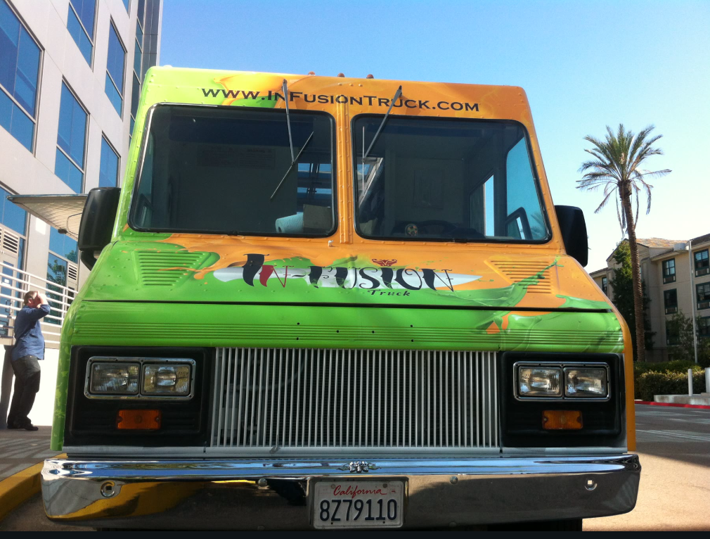 The orange-and-lime InFusion food truck photographed straight on like a portrait