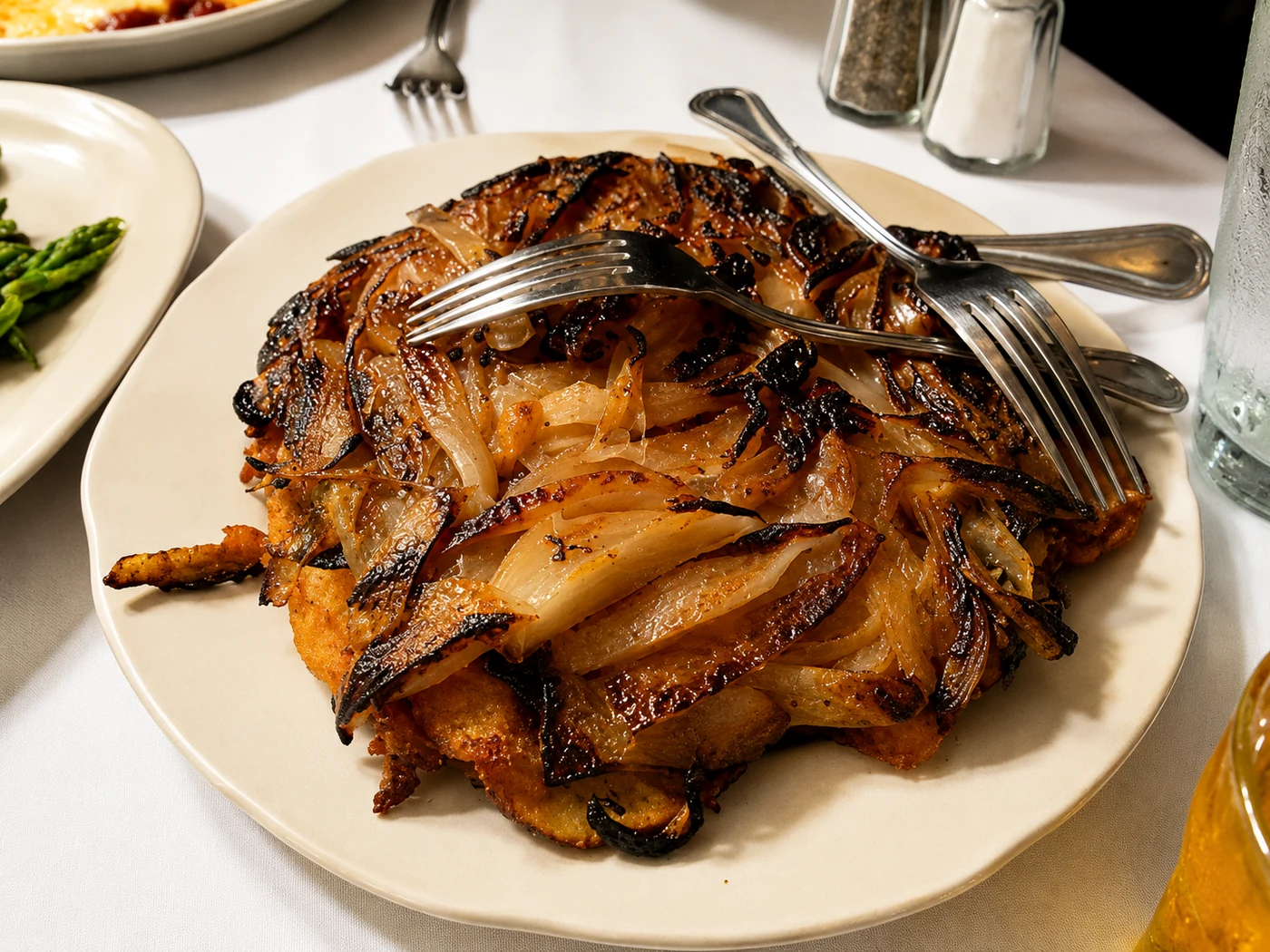 Visual reconstruction of a large plate of caramelized Lyonnaise potatoes and onions
