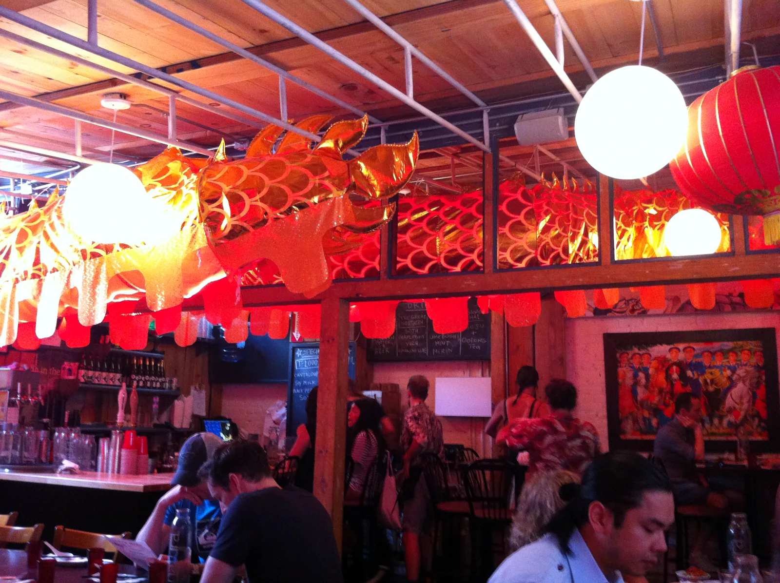 Mission Chinese Food dining room with illuminated dragon decorations
