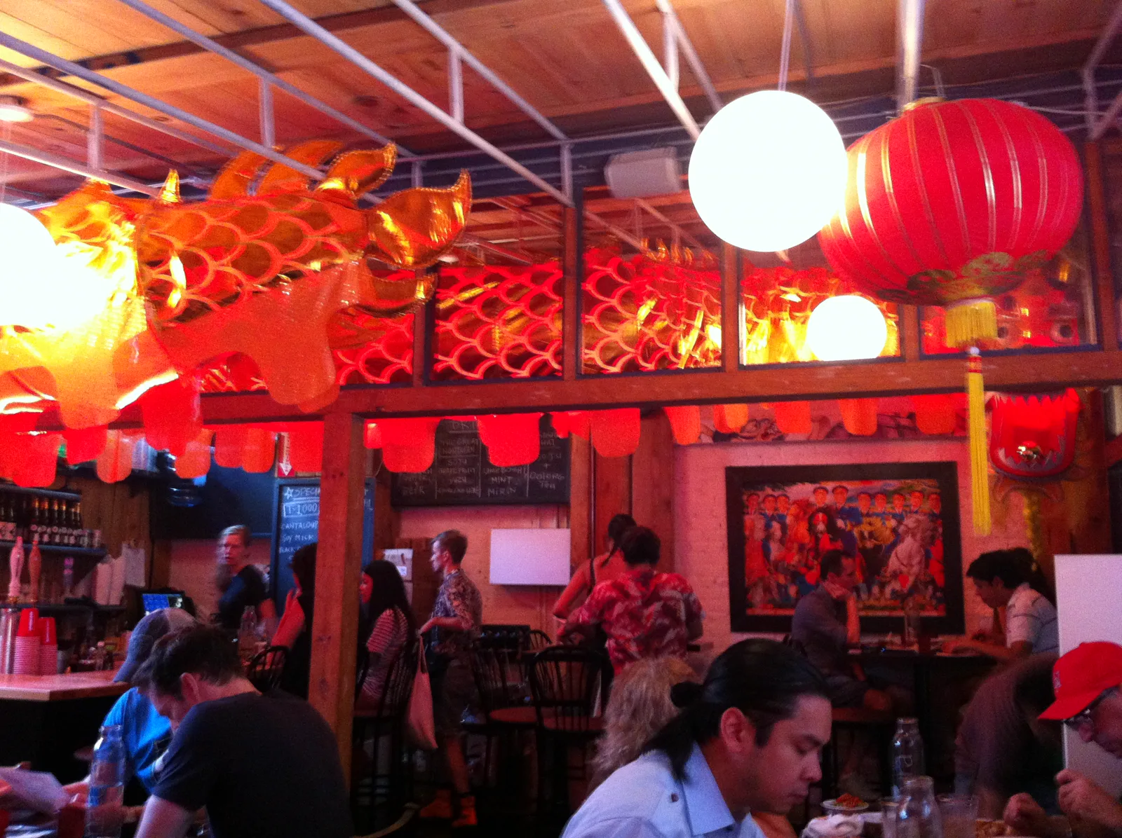 Red lanterns and dragon decorations above the dining room