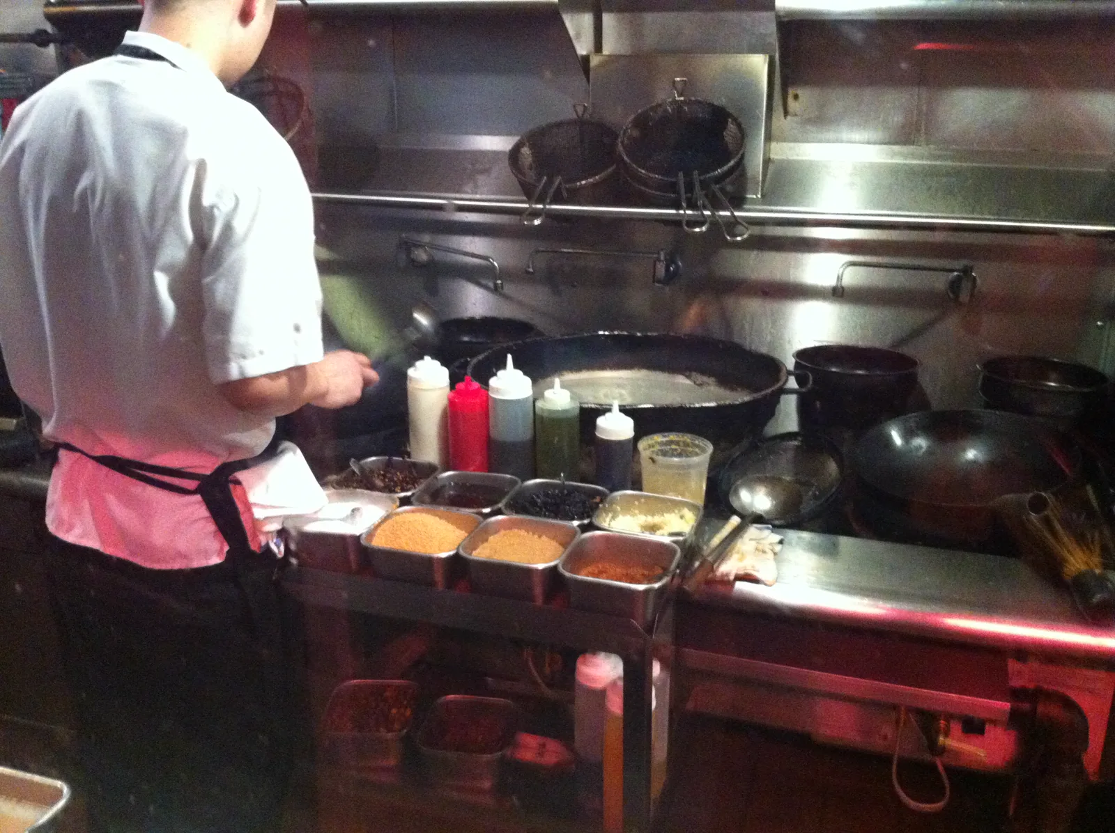 A cook at the wok station