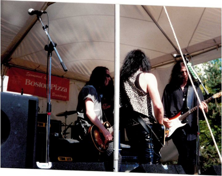 Musicians performing beneath the festival tent