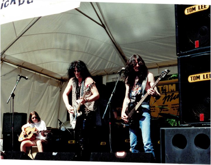 Guitarist and bassist performing on stage