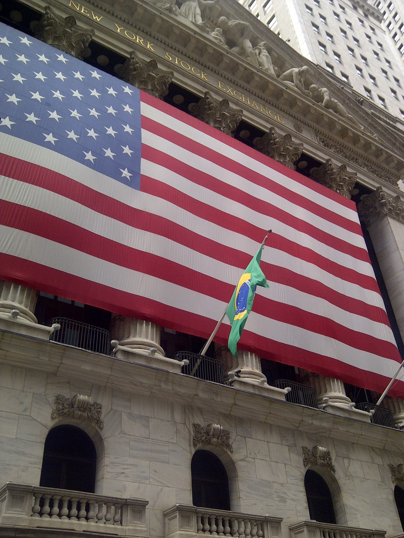 The New York Stock Exchange draped with a monumental United States flag in June 2012