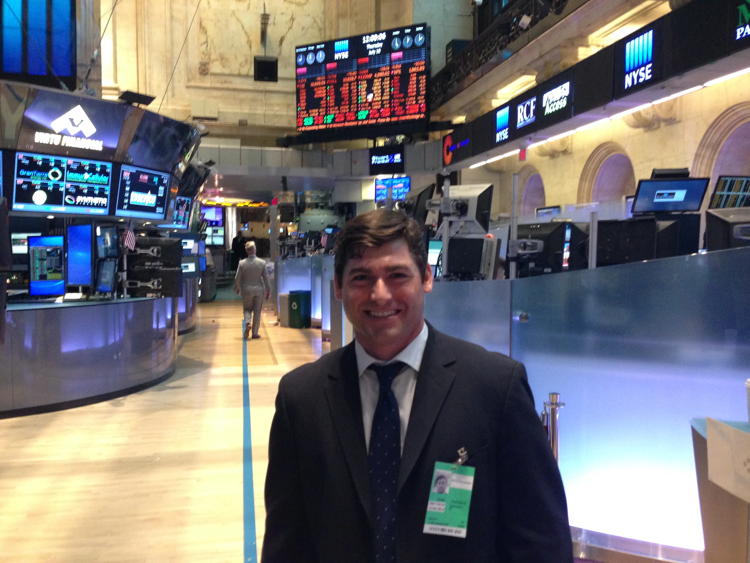 Adam Pasquale standing on the floor of the New York Stock Exchange