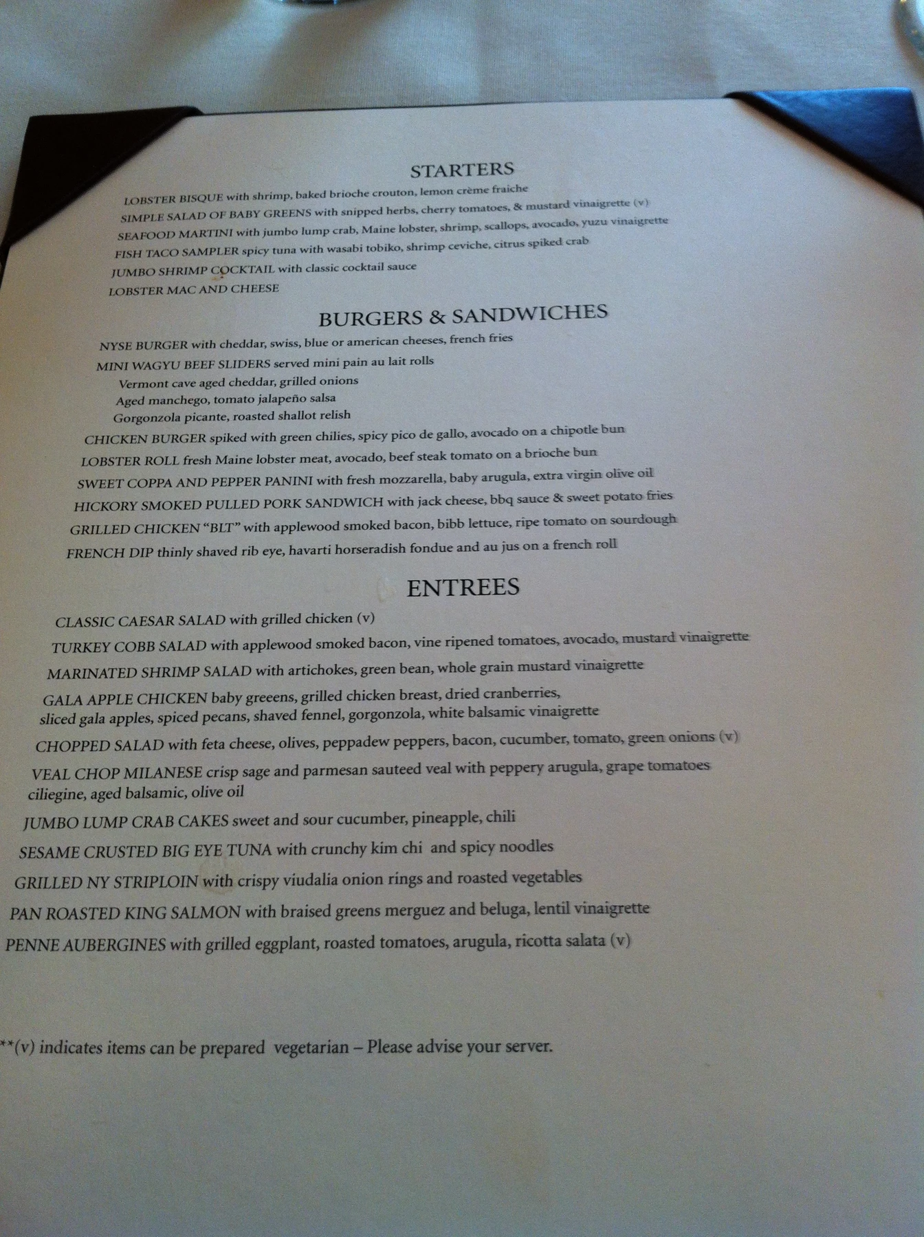 An original 1792 restaurant menu photographed at the table
