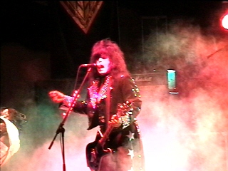 Benny Doro singing as Paul Stanley, photograph 6 of 22