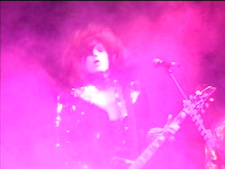 Benny Doro performing through pink stage smoke, photograph 16 of 22