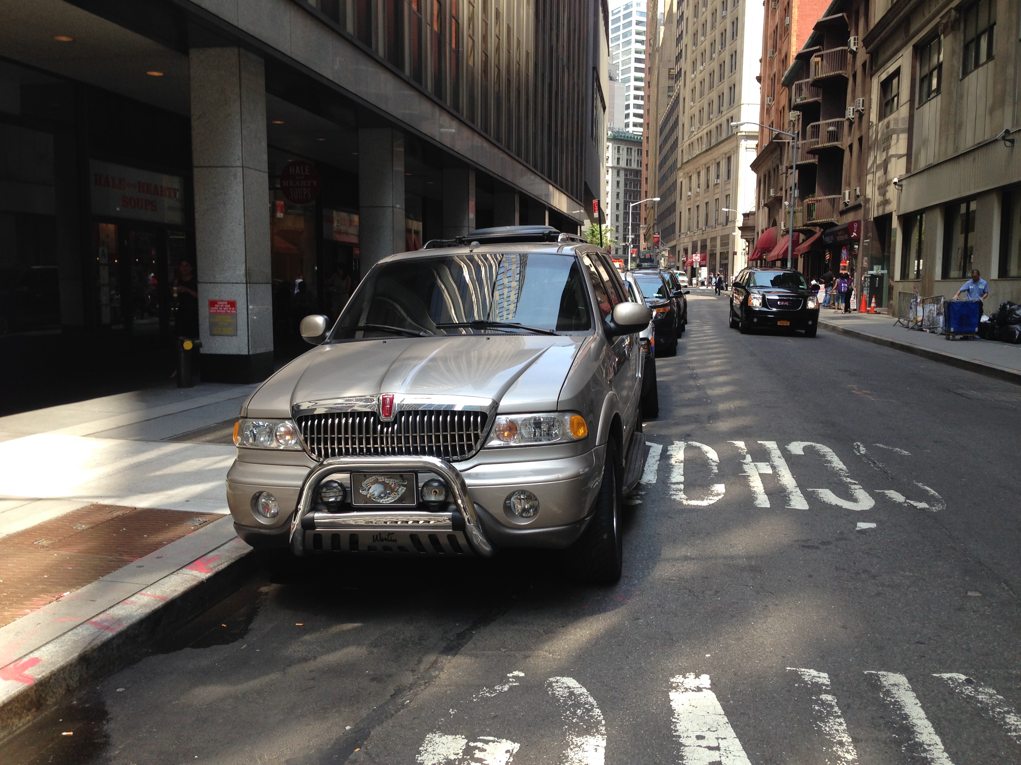 Benny Doro's silver 2000 Lincoln Navigator parked outside 55 Broad Street in New York City.
