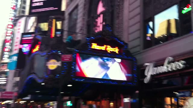 Times Square signs, lights and crowds captured from Benny Doro's moving camera